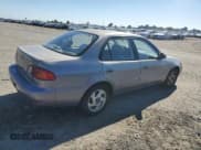✅ 1998 Toyota Corolla LE • VIN: 1NXBR18E5WZ099366 • Лот: 87099535. Опубликован ранее на Copart с пробегом 173 725 миль. Бесплатный доступ к архиву аукционных продаж из США и подробный отчёт об истории автомобиля на DreamBid. Изображение 3.