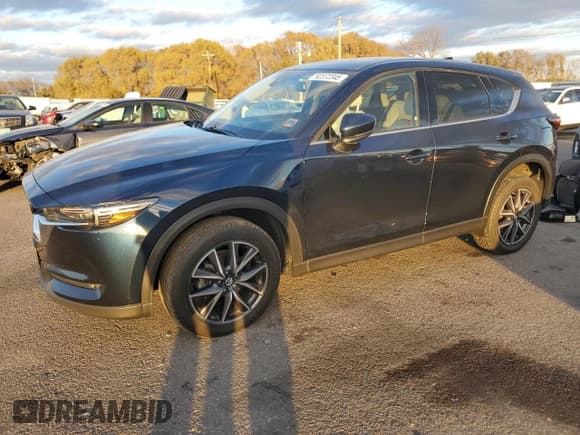 ✅ 2018 Mazda CX-5 Grand Touring • VIN: JM3KFBDM2J0340940 • Lot: 92372345. Listed on Copart with 91,288 mi. Free auction sales archive from the USA and detailed vehicle history report at DreamBid. Image 1.