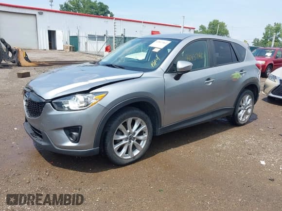 ✅ 2015 Mazda CX-5 Grand Touring • VIN: JM3KE4DY9F0517346 • Lot: 42837462. Listed on IAAI with 124,004 mi. Free auction sales archive from the USA and detailed vehicle history report at DreamBid. Image 17.
