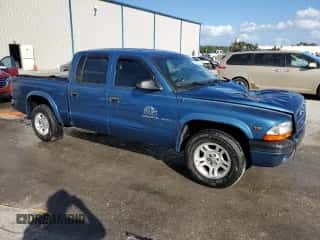 2002 Dodge Dakota Sport z VIN 1B7HL38N72S589857, wystawiony jako Copart lot #77138924 z przebiegiem 197 117 mil mil oraz Szkoda całkowita • Salvage title. Historia ofert i sprzedaży dostępna na DreamBid. Obrazek 4.