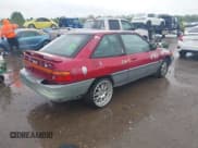 ✅ 1995 Ford Escort • VIN: 1FASP11J5SW107553 • Lot: 42202877. Listed on IAAI with 76,751 mi. Free auction sales archive from the USA and detailed vehicle history report at DreamBid. Image 4.