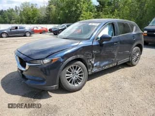 ✅ 2021 Mazda CX-5 Touring • VIN: JM3KFACM7M0113548 • Лот: 66671995. Опубликован ранее на Copart с пробегом 75 399 миль. Бесплатный доступ к архиву аукционных продаж из США и подробный отчёт об истории автомобиля на DreamBid. Изображение 1.