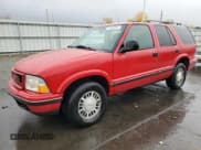 ✅ 1998 GMC Jimmy SLE • VIN: 1GKDT13W1W2508350 • Лот: 77904394. Опубликован ранее на Copart с пробегом 175 000 миль. Бесплатный доступ к архиву аукционных продаж из США и подробный отчёт об истории автомобиля на DreamBid. Изображение 1.