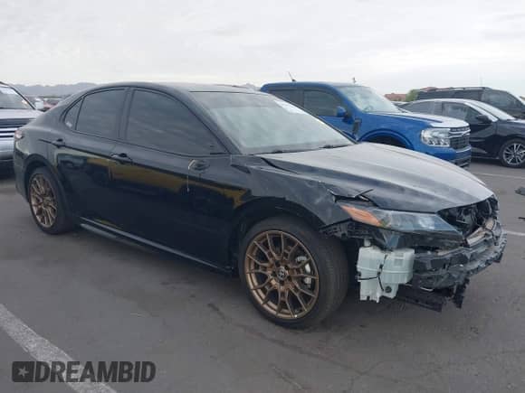 2023 Toyota Camry SE with VIN 4T1G11BK2PU105668, listed as a IAAI auction lot 43013320 with 39,694 mi miles and . Bid and sale history available at DreamBid. Image 1.