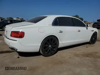 ✅ 2014 Bentley Flying Spur • VIN: SCBEC9ZA1EC091219 • Лот: 70480844. Опубликован ранее на Copart с пробегом 64 404 миль. Бесплатный доступ к архиву аукционных продаж из США и подробный отчёт об истории автомобиля на DreamBid. Изображение 3.