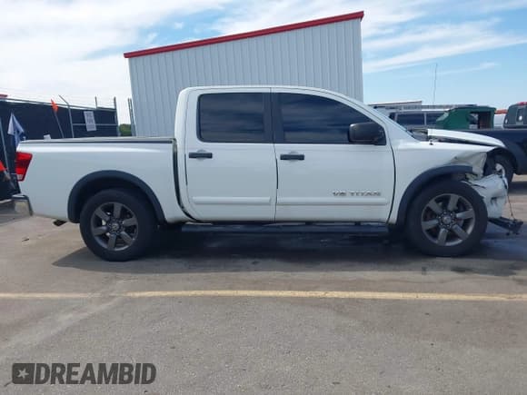 ✅ 2015 Nissan Titan SL • VIN: 1N6BA0ED1FN504342 • Lot: 43410292. Listed on IAAI with 168,238 mi. Free auction sales archive from the USA and detailed vehicle history report at DreamBid. Image 13.