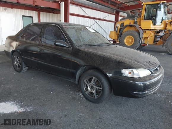 ✅ 1999 Toyota Corolla VE • VIN: 1NXBR12E0XZ197084 • Lot: 43220717. Listed on IAAI with 169,897 mi. Free auction sales archive from the USA and detailed vehicle history report at DreamBid. Image 1.