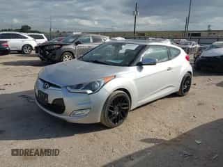 2013 Hyundai Veloster w/Black Int with VIN KMHTC6AD4DU122234, listed as a IAAI auction lot 43485517 with 118,478 mi miles and . Bid and sale history available at DreamBid. Image 2.