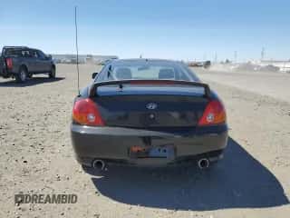 2004 Hyundai Tiburon GT с VIN KMHHN65F94U113699, выставлен на аукционе Copart как лот 53858355 с пробегом 221 999 миль миль и Списание • Salvage title. История ставок и продаж доступна на DreamBid. Изображение 6.