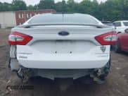 ✅ 2013 Ford Fusion Titanium Hybrid • VIN: 3FA6P0RU6DR315585 • Lot: 42598359. Listed on IAAI with 153,669 mi. Free auction sales archive from the USA and detailed vehicle history report at DreamBid. Image 8.