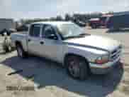 2003 Dodge Dakota SLT z VIN 1D7HL48XX3S197440, wystawiony jako Copart lot #61722005 z przebiegiem 167 398 mil mil oraz Czysty tytuł • Clean title. Historia ofert i sprzedaży dostępna na DreamBid. Obrazek 4.