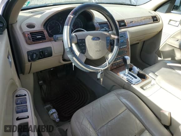 ✅ 2005 Ford Five Hundred SEL • VIN: 1FAFP24195G178384 • Лот: 86073055. Опубликован ранее на Copart с пробегом Не указан. Бесплатный доступ к архиву аукционных продаж из США и подробный отчёт об истории автомобиля на DreamBid. Изображение 8.