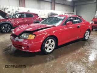 2003 Hyundai Tiburon с VIN KMHHM65D73U018137, выставлен на аукционе Copart как лот 50370215 с пробегом 162 258 миль миль и Списание • Salvage title. История ставок и продаж доступна на DreamBid. Изображение 1.