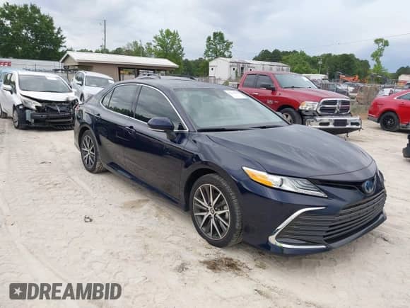 2022 Toyota Camry Hybrid XLE with VIN 4T1F31AK4NU591517, listed as a IAAI auction lot 42216959 with 36,048 mi miles and . Bid and sale history available at DreamBid. Image 1.
