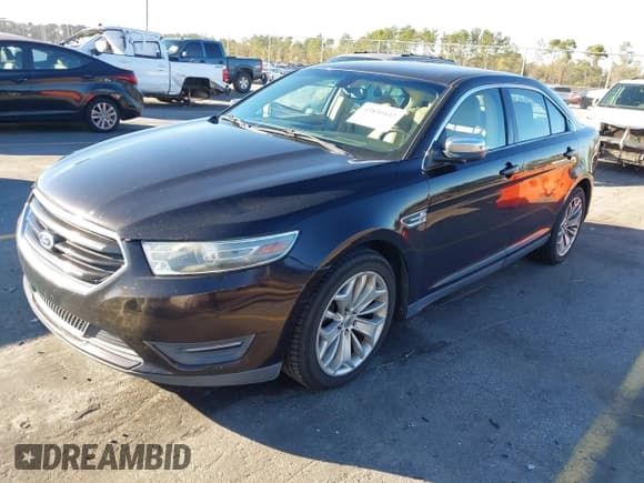 ✅ 2014 Ford Taurus Limited • VIN: 1FAHP2F88EG112833 • Lot: 43890442. Listed on IAAI with 151,894 mi. Free auction sales archive from the USA and detailed vehicle history report at DreamBid. Image 2.