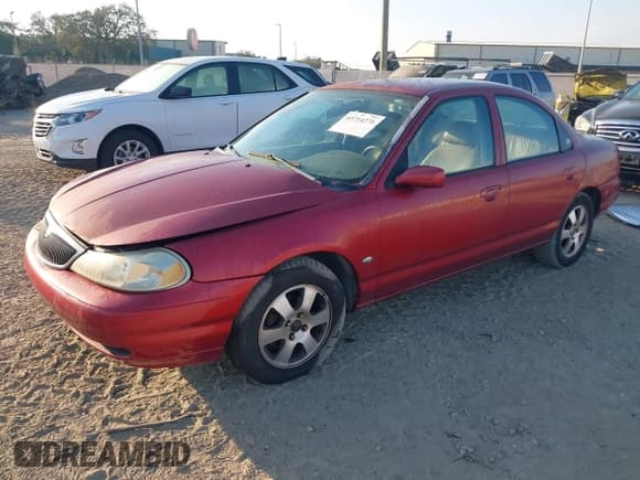 ✅ 1999 Mercury Mystique • VIN: 1MEFM66L8XK608607 • Lot: 43714271. Listed on IAAI with 65,518 mi. Free auction sales archive from the USA and detailed vehicle history report at DreamBid. Image 2.