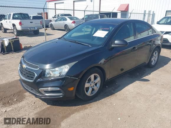 2014 Chevrolet Cruze 1LT with VIN 1G1PC5SB6E7465214, listed as a IAAI auction lot 43358660 with 99,999 mi miles and . Bid and sale history available at DreamBid. Image 2.