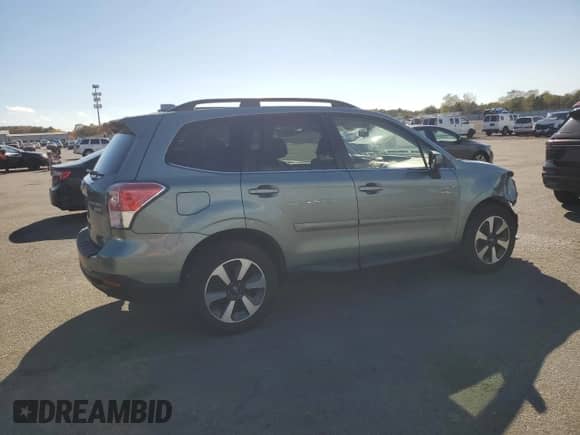 2017 Subaru Forester Limited with VIN JF2SJARC0HH523882, listed as a Copart auction lot 82651095 with 65,088 mi miles and Salvage title. Bid and sale history available at DreamBid. Image 3.