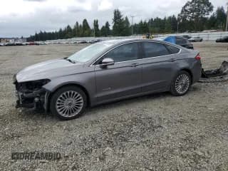 ✅ 2013 Ford Fusion Titanium Hybrid • VIN: 3FA6P0RU7DR345548 • Lot: 67648065. Wystawiony na Copart z przebiegiem 110 002 mil. Bezpłatny archiwum sprzedaży aukcyjnych z USA i szczegółowy raport historii pojazdu na DreamBid. Zdjęcie 1.