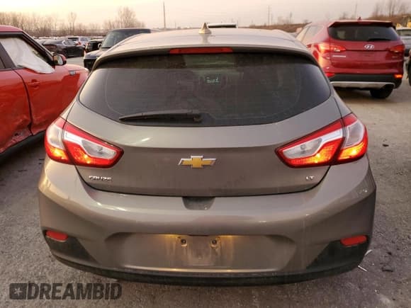 ✅ 2018 Chevrolet Cruze LT • VIN: 3G1BE6SM1JS538836 • Lot: 69879722. Listed on Copart with 128,804 mi. Free auction sales archive from the USA and detailed vehicle history report at DreamBid. Image 6.