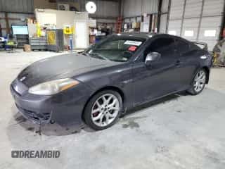 ✅ 2008 Hyundai Tiburon GT • VIN: KMHHN66F18U280756 • Лот: 81469935. Опубликован ранее на Copart с пробегом 227 955 миль. Бесплатный доступ к архиву аукционных продаж из США и подробный отчёт об истории автомобиля на DreamBid. Изображение 1.