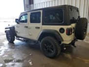✅ 2022 Jeep Wrangler Unlimited Sport S • VIN: 1C4HJXDG6NW186034 • Lot: 54601555. Listed on Copart with 67,486 mi. Free auction sales archive from the USA and detailed vehicle history report at DreamBid. Image 2.