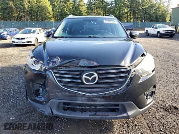 ✅ 2016 Mazda CX-5 Grand Touring • VIN: JM3KE4DY5G0764140 • Lot: 93164335. Listed on Copart with 97,167 mi. Free auction sales archive from the USA and detailed vehicle history report at DreamBid. Image 5.