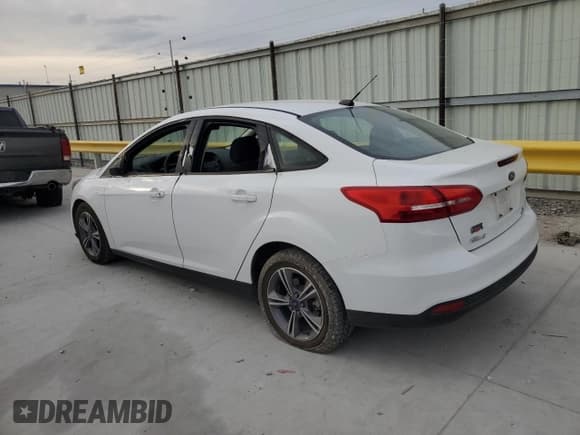 ✅ 2018 Ford Focus SE • VIN: 1FADP3FE7JL229119 • Lot: 87000115. Listed on Copart with 138,033 mi. Free auction sales archive from the USA and detailed vehicle history report at DreamBid. Image 2.