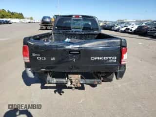 2003 Dodge Dakota SLT z VIN 1D7HL42X33S284170, wystawiony jako Copart lot #76657204 z przebiegiem 146 790 mil mil oraz Szkoda całkowita • Salvage title. Historia ofert i sprzedaży dostępna na DreamBid. Obrazek 6.