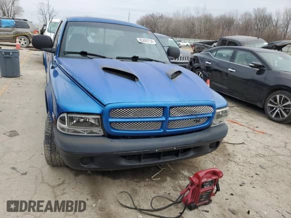 1999 Dodge Dakota Sport z VIN 1B7GL22Z7XS110023, wystawiony jako Copart lot #85889754 z przebiegiem Nie podano mil oraz Szkoda całkowita • Salvage title. Historia ofert i sprzedaży dostępna na DreamBid. Obrazek 5.