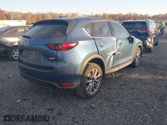 ✅ 2019 Mazda CX-5 Grand Touring Reserve • VIN: JM3KFBDYXK0568219 • Lot: 43619359. Listed on IAAI with 65,252 mi. Free auction sales archive from the USA and detailed vehicle history report at DreamBid. Image 4.