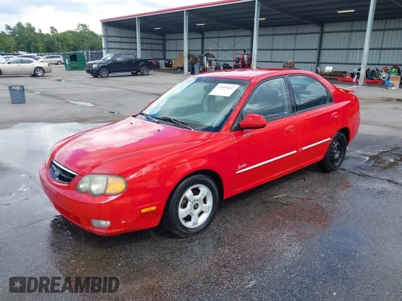 ✅ 2002 Kia Spectra GS • VIN: KNAFB161X25089511 • Лот: 42497052. Опубликован ранее на IAAI с пробегом 262 867 миль. Бесплатный доступ к архиву аукционных продаж из США и подробный отчёт об истории автомобиля на DreamBid. Изображение 2.