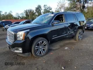 ✅ 2018 GMC Yukon Denali • VIN: 1GKS2CKJ6JR108814 • Lot: 87283775. Listed on Copart with 74,408 mi. Free auction sales archive from the USA and detailed vehicle history report at DreamBid. Image 1.