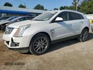 ✅ 2016 Cadillac SRX Premium Collection • VIN: 3GYFNDE32GS548343 • Lot: 63218175. Wystawiony na Copart z przebiegiem 91 265 mil. Bezpłatny archiwum sprzedaży aukcyjnych z USA i szczegółowy raport historii pojazdu na DreamBid. Zdjęcie 1.