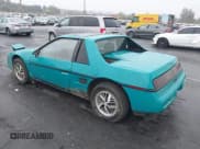 ✅ 1988 Pontiac Fiero • VIN: 1G2PE11R1JP210798 • Lot: 43472064. Wystawiony na IAAI z przebiegiem 136 233 mil. Bezpłatny archiwum sprzedaży aukcyjnych z USA i szczegółowy raport historii pojazdu na DreamBid. Zdjęcie 3.