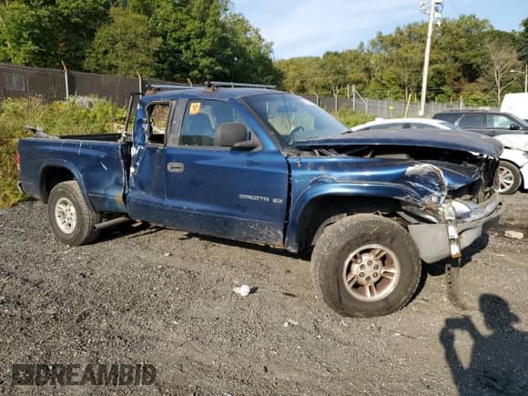 2000 Dodge Dakota Sport z VIN 1B7GG22N2YS659373, wystawiony jako Copart lot #75728094 z przebiegiem Nie podano mil oraz Szkoda całkowita • Salvage title. Historia ofert i sprzedaży dostępna na DreamBid. Obrazek 4.