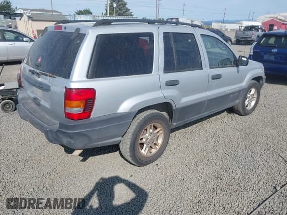✅ 2004 Jeep Grand Cherokee Laredo • VIN: 1J4GW48S34C272700 • Lot: 42494918. Listed on IAAI with 214,843 mi. Free auction sales archive from the USA and detailed vehicle history report at DreamBid. Image 4.