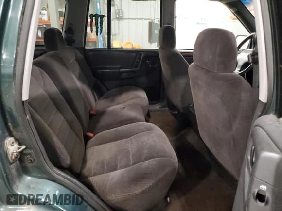 ✅ 1996 Jeep Grand Cherokee Laredo • VIN: 1J4GZ58S9TC198257 • Lot: 93327175. Listed on Copart with 169,183 mi. Free auction sales archive from the USA and detailed vehicle history report at DreamBid. Image 11.