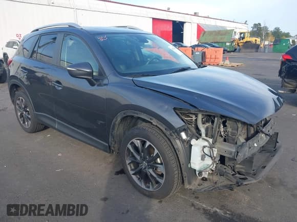 ✅ 2016 Mazda CX-5 Grand Touring • VIN: JM3KE4DY4G0880137 • Lot: 43516086. Wystawiony na IAAI z przebiegiem 135 661 mil. Bezpłatny archiwum sprzedaży aukcyjnych z USA i szczegółowy raport historii pojazdu na DreamBid. Zdjęcie 1.