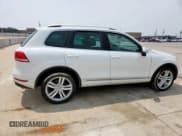 ✅ 2013 Volkswagen Touareg Exec • VIN: WVGEF9BP3DD012463 • Lot: 57499915. Listed on Copart with 104,981 mi. Free auction sales archive from the USA and detailed vehicle history report at DreamBid. Image 3.