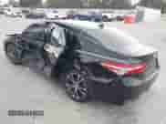 2019 Toyota Camry LE with VIN 4T1B11HK2KU833243, listed as a IAAI auction lot 42855313 with 128,404 mi miles and . Bid and sale history available at DreamBid. Image 3.