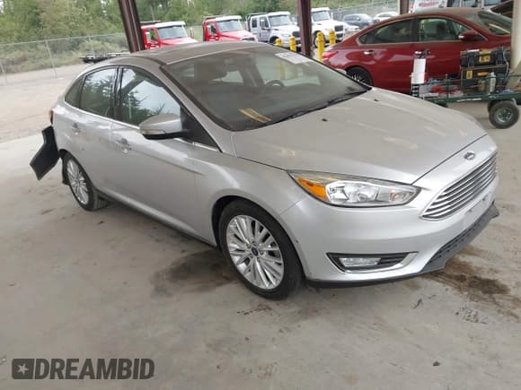 ✅ 2017 Ford Focus Titanium • VIN: 1FADP3J29HL329410 • Lot: 42493519. Listed on IAAI with 22,639 mi. Free auction sales archive from the USA and detailed vehicle history report at DreamBid. Image 1.