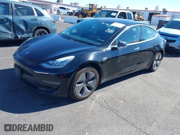 ✅ 2019 Tesla Model 3 Mid Range • VIN: 5YJ3E1EA1KF306117 • Лот: 43477225. Опубликован ранее на IAAI с пробегом 121 347 миль. Бесплатный доступ к архиву аукционных продаж из США и подробный отчёт об истории автомобиля на DreamBid. Изображение 2.