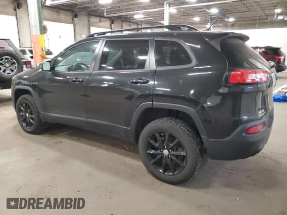 ✅ 2014 Jeep Cherokee Latitude • VIN: 1C4PJMCS0EW294973 • Lot: 93135185. Listed on Copart with 125,392 mi. Free auction sales archive from the USA and detailed vehicle history report at DreamBid. Image 2.