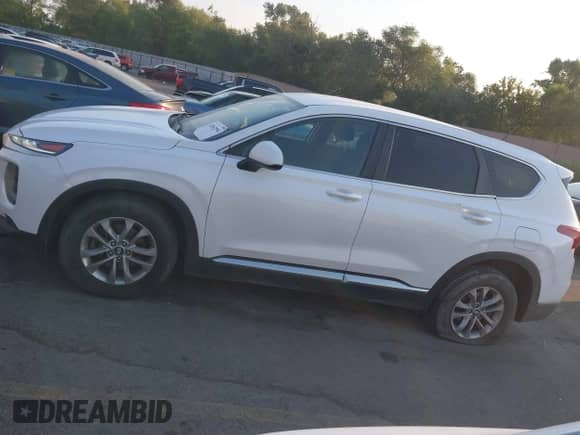 2020 Hyundai Santa Fe SE z VIN 5NMS2CAD0LH232950, wystawiony jako IAAI lot #42842994 z przebiegiem 142 813 mil mil oraz . Historia ofert i sprzedaży dostępna na DreamBid. Obrazek 14.