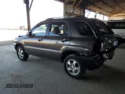 ✅ 2006 Kia Sportage LX • VIN: KNDJF724067201067 • Лот: 81590125. Опубликован ранее на Copart с пробегом 146 868 миль. Бесплатный доступ к архиву аукционных продаж из США и подробный отчёт об истории автомобиля на DreamBid. Изображение 2.