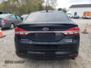 ✅ 2017 Ford Fusion Hybrid Titanium • VIN: 3FA6P0RU7HR278472 • Lot: 82434245. Wystawiony na Copart z przebiegiem 144 287 mil. Bezpłatny archiwum sprzedaży aukcyjnych z USA i szczegółowy raport historii pojazdu na DreamBid. Zdjęcie 6.