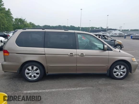 ✅ 2003 Honda Odyssey EX-L • VIN: 5FNRL18043B110922 • Лот: 42917656. Опубликован ранее на IAAI с пробегом 213 269 миль. Бесплатный доступ к архиву аукционных продаж из США и подробный отчёт об истории автомобиля на DreamBid. Изображение 14.