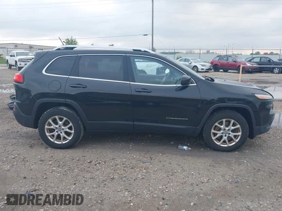 ✅ 2014 Jeep Cherokee Altitude • VIN: 1C4PJMCS4EW297696 • Lot: 42459285. Listed on IAAI with 196,772 mi. Free auction sales archive from the USA and detailed vehicle history report at DreamBid. Image 14.