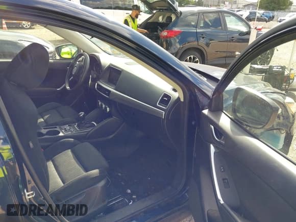 ✅ 2016 Mazda CX-5 Touring • VIN: JM3KE2CY7G0849891 • Lot: 43288504. Listed on IAAI with 133,906 mi. Free auction sales archive from the USA and detailed vehicle history report at DreamBid. Image 5.